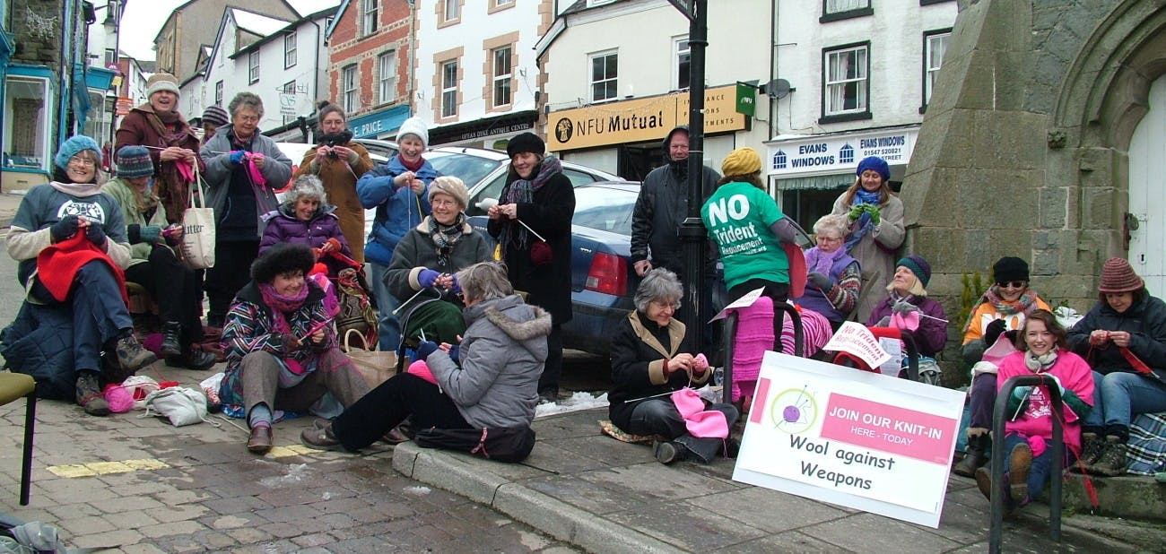 23a-Knitting-Pink-Peace-Scarf.jpg