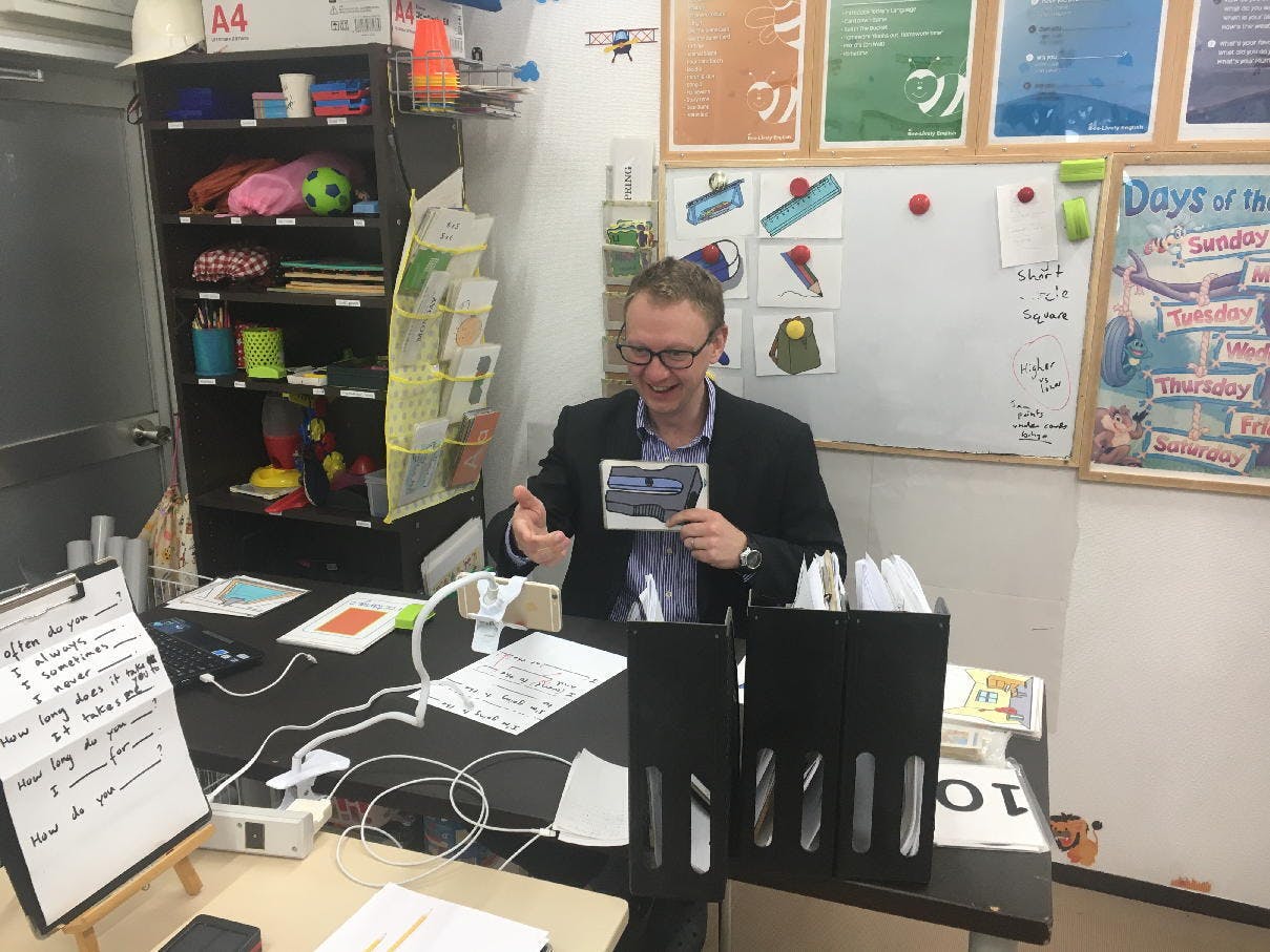 One of our teacher teaching an online lesson to a child